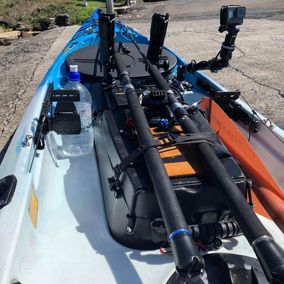 Viking profish reload kayak setup for surf launch, showing rods flattened and strapped, reels removed, and electronics stored.