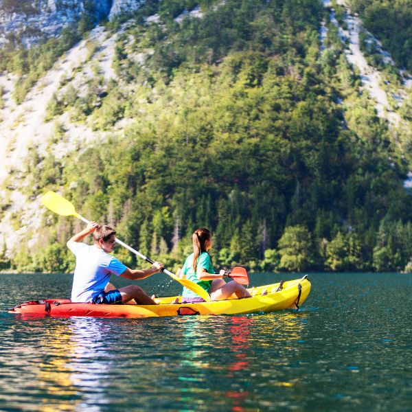 Group kayaking through a scenic gorge or river